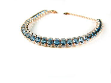 Armband tennis in zilver roos goud verguld gezet met blauwe stenen en cubic zirconia