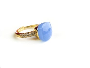 Ring in zilver geelgoud verguld model Pomellato met licht blauwe steen en cubic zirconia