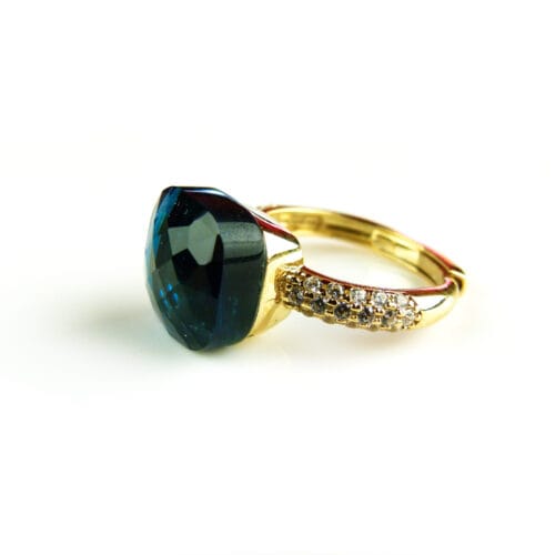 Ring in zilver geelgoud verguld model Pomellato met donkerblauwe steen en cubic zirconia